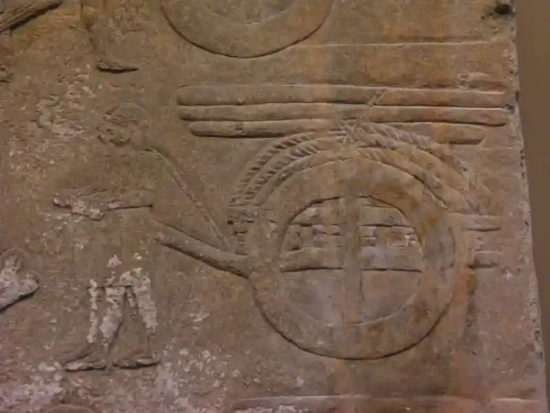 Four-pointed cross inside a circle as the wheel of wood carriage